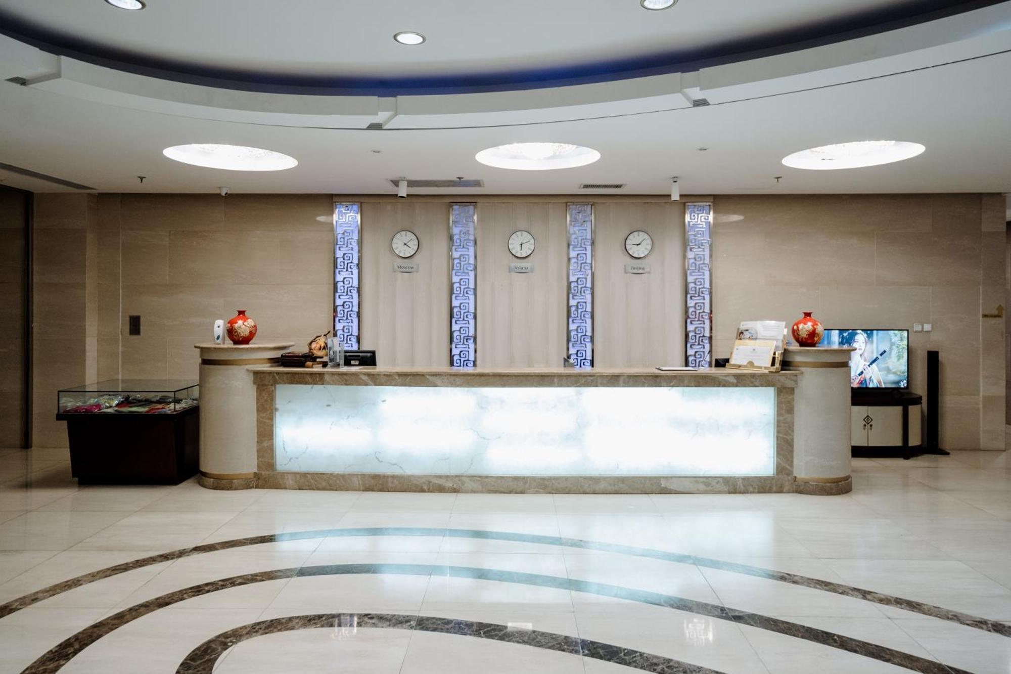 Beijing Palace Soluxe Hotel Astana Esterno foto Reception desk